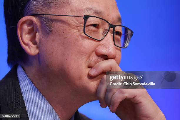 World Bank President Jim Yong Kim listens to reporters' questions during a news conference at IMF Headquarters April 19, 2018 in Washington, DC. The...