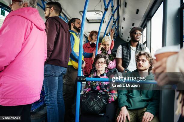 students going to lectures by bus - huddle stock pictures, royalty-free photos & images