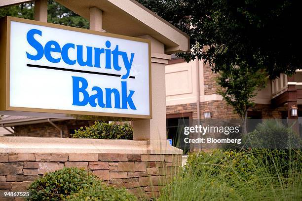 Sign hangs outside a Security Bank branch in Alpharetta, Georgia, U.S., on Tuesday, July 22, 2008. Housing-bust ripples are common in Atlanta, now...