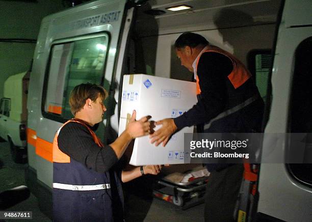 Romanian health officials unload boxes of bird flu vaccine at a hospital in Tulcea, Romania, on Sunday, October 9, 2005. Officials quarantined the...