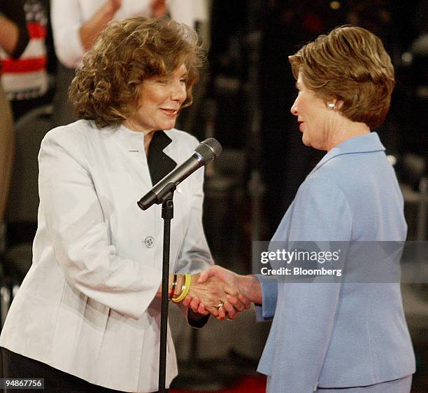 First Lady Laura Bush, right, shakes hands with Teresa Heinz Kerry prior to the start of the second Presidential Debate held in the Athletic Complex...