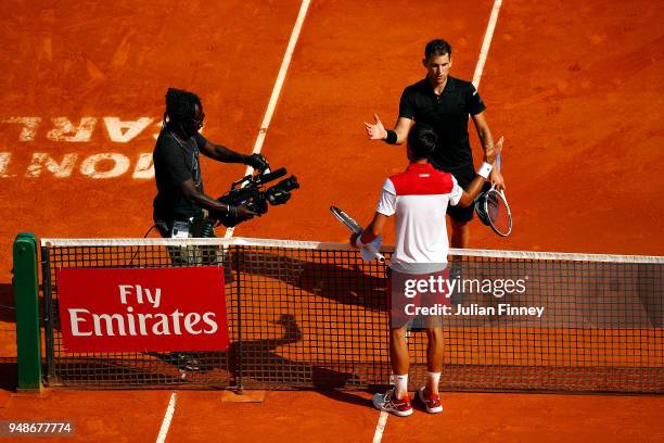 Dominic Thiem of Austria shakes hands with Novak Djokovic of Serbia after beating him in their men's singles 3rd round match on day five of the Rolex...