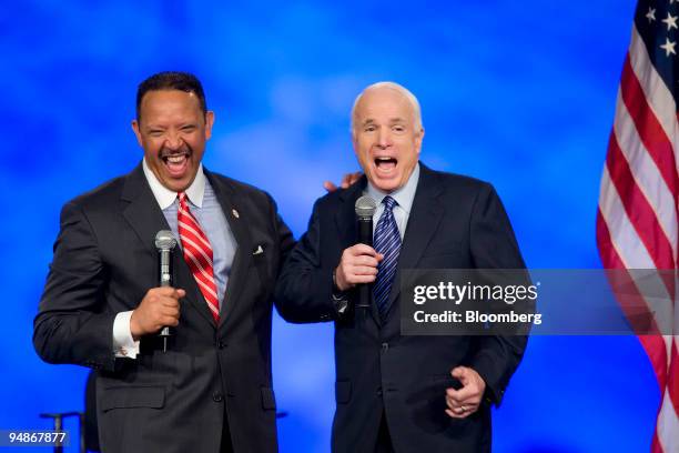 John McCain, U.S. Senator from Arizona and Republican presidential candidate, right, shares a laugh with Marc Morial, president and chief executive...