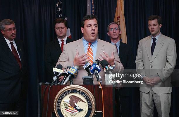 Christopher J. Christie, United States Attorney of the District of New Jersey, center, gestures during a news conference in Newark, New Jersey...