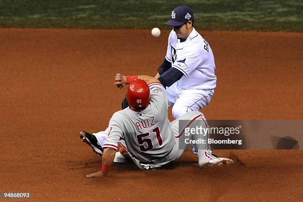 Carlos Ruiz of the Philadelphia Phillies, foreground, is safe after stealing second base against the Tampa Bay Rays in the seventh inning of game two...