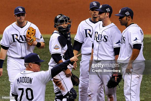 Joe Maddon, manager of the Tampa Bay Rays, foreground, points to the bullpen to relieve pitcher James Shields during game two of the Major League...