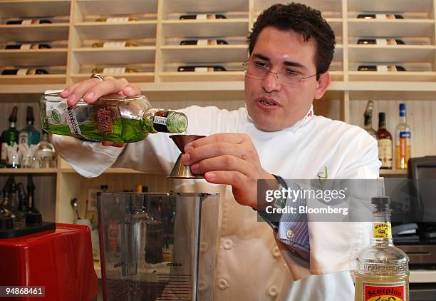 Mixologist Junior Merino mixes a cocktail at Macondo in the Lower East Side neighborhood of New York, U.S., on July 30, 2008. Merino doesn't call...