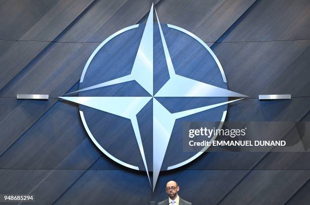 The NATO logo is pictured inside the new North Atlantic Council meeting room at the new NATO headquarters during a press tour of the facilities as...