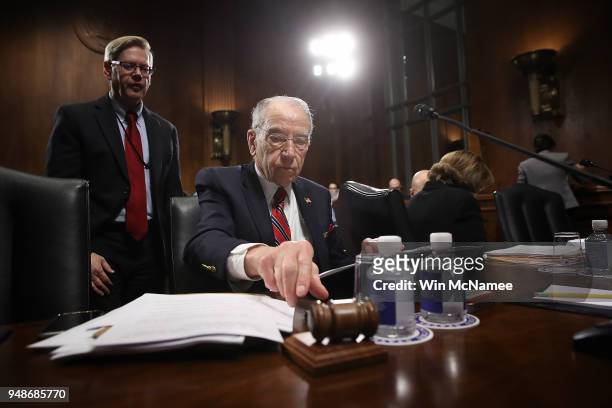 Senate Judiciary Committee Chairman Chuck Grassley reaches for his gavel at the start of a Judiciary Committee hearing April 19, 2018 in Washington,...