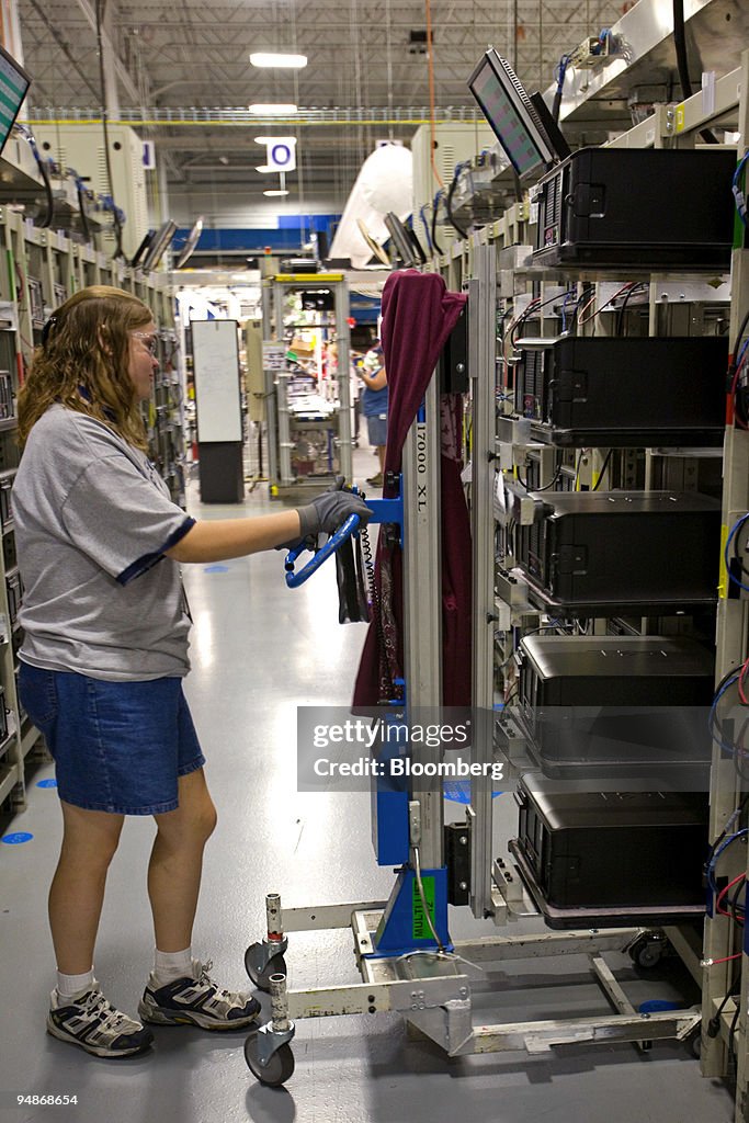 Karen Parker, a Dell Inc. employee, moves Dell OptiPlex desk
