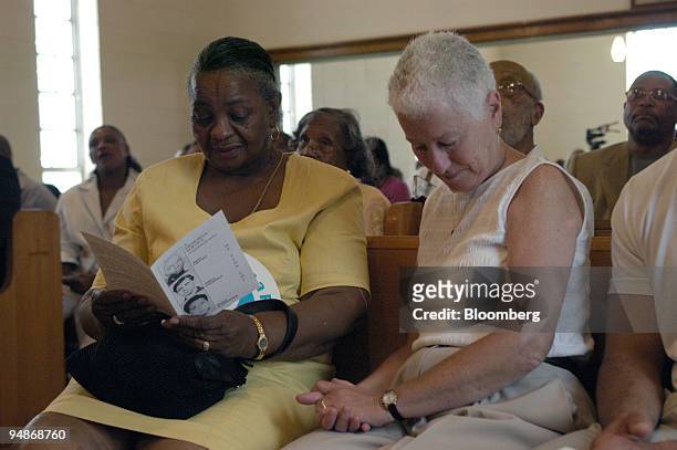 Rita Schwerner Bender, right, widow of murdered civil rights worker Michael "Micky" Schwerner, bows her head during the memorial service at the Mt....