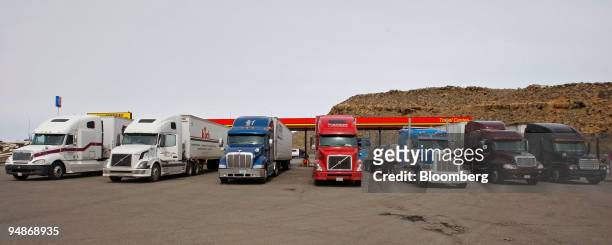 Trucks line up after filling their rigs with diesel at a truck stop along Interstate 80 in Evenston, Wyoming, U.S., on Tuesday, April 1, 2008....