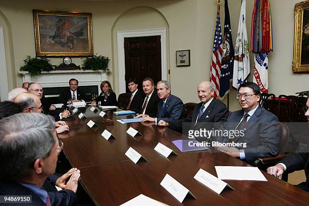 President George W. Bush meets with vaccine manufacturers at the White House on Friday, October 7, 2005. Pictured from left to right on Bush s side...