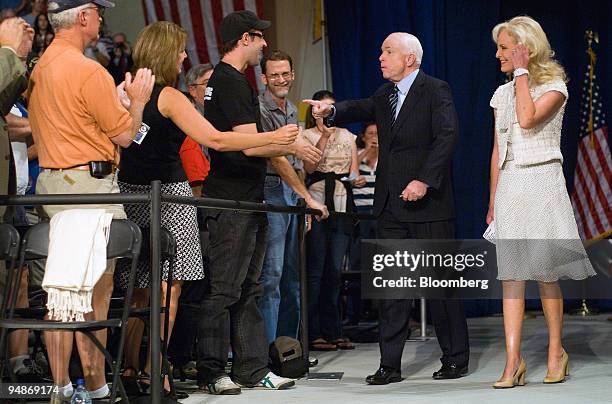 John McCain, U.S. Senator from Arizona and Republican presidential candidate, second from the right, and his wife Cindy McCain, right, greet...