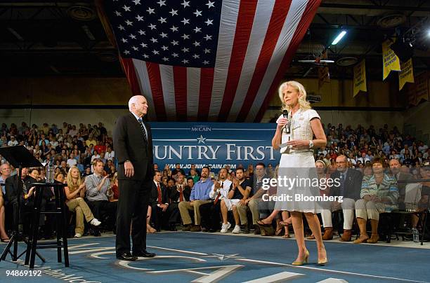 John McCain, U.S. Senator from Arizona and Republican presidential candidate, left, listens to his wife Cindy McCain, right, introduce him during a...