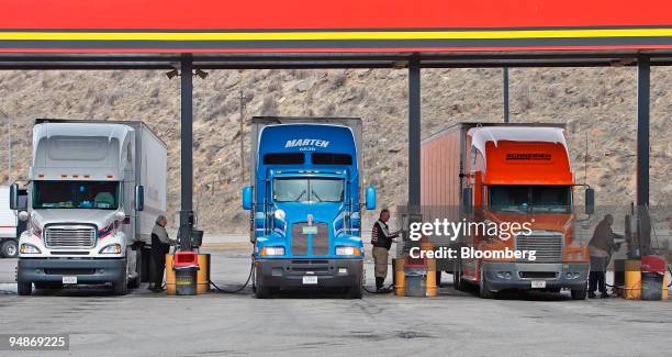 Truckers fill their rigs with diesel at a truck stop in Evenston, Wyoming, U.S., on Tuesday, April 1, 2008. Truckers clogged the New Jersey Turnpike...