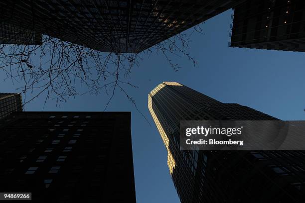 Sunlight illuminates an edge of the Bear Stearns Cos. Headquarters across the street from JPMorgan Chase & Co. Headquarters, top left, in New York,...