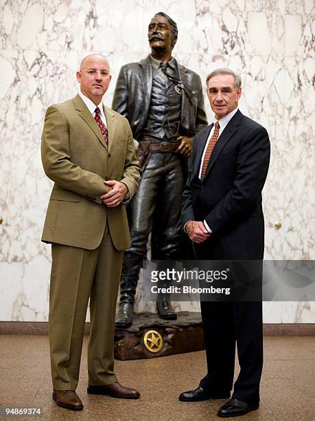 Eben Morales, chief of the asset forfeiture office for the U.S. Marshals Service, left, and Leonard Briskman, deputy chief for business management,...