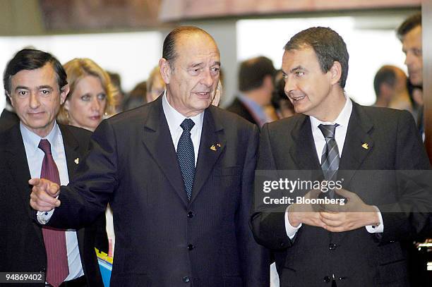 French President Jacques Chirac, left, arrives with Spanish Prime Minister Jose Luis Rodriguez Zapatero, right, at the EU Summit in Brussels,...