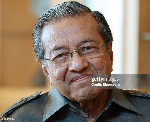 Mahathir Mohamad, Malaysia's former prime minister, smiles during an interview at his office, in Putrajaya, Malaysia, on Wednesday, Oct. 22, 2008....