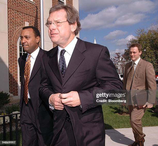 Michael Ovitz, center, former Walt Disney Co. President and Attorney Bart Williams, left, return to the Delaware Chancery Court after a lunch recess...