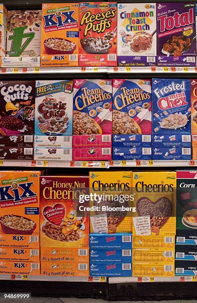 Brands of General Mills cereals sit on display in an Associated Supermarket in New York on March 16, 2004. Nestle SA, the world's largest foodmaker,...