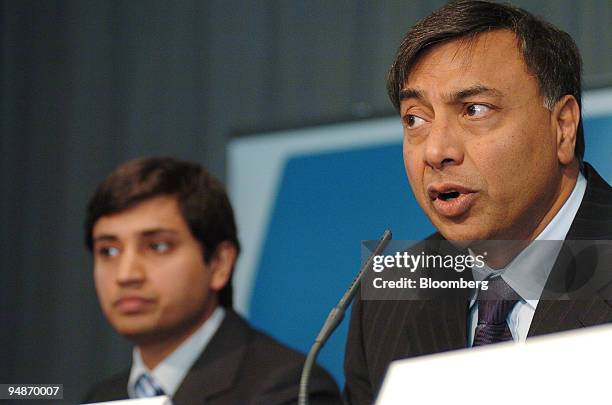 Lakshmi Mittal, chairman and chief executive of Mittal Steel Co., right, speaks at a press conference, watched by Aditya Mittal, group financial...