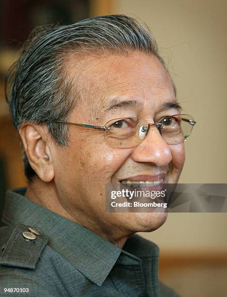 Mahathir Mohamad, Malaysia's former prime minister, smiles during an interview at his office, in Putrajaya, Malaysia, on Wednesday, Oct. 22, 2008....