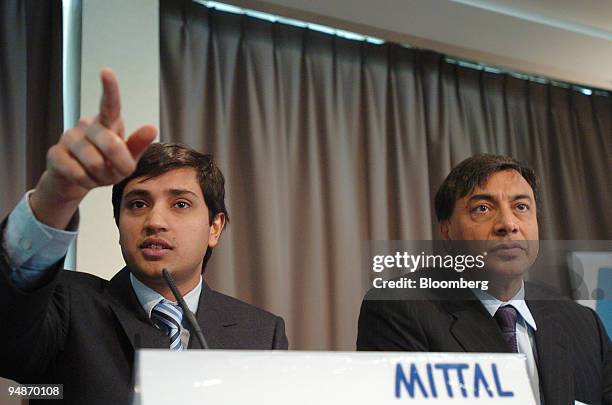 Aditya Mittal, group financial officer, left, speaks at the Mittal press conference, watched by Lakshmi Mittal, chairman and chief executive of...