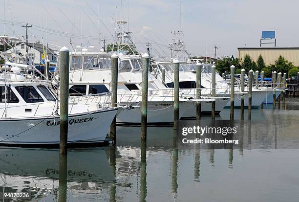 Power boats sit docked at the South Jersey Marina in Cape May, New Jersey, U.S., on Thursday, July 17, 2008. Durand Blane measures the rising cost of...