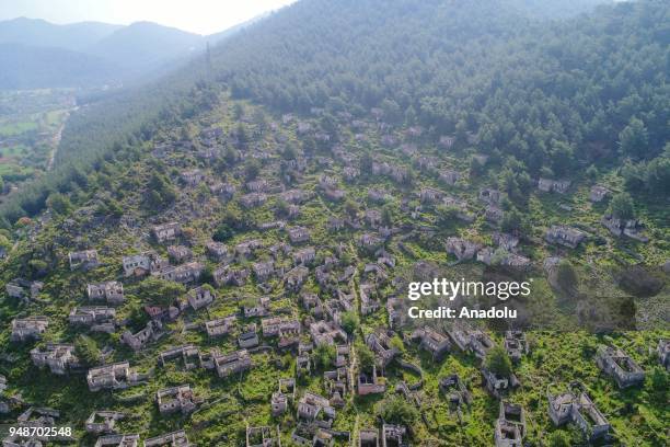 An aerial view of Greek houses and its surroundings are seen on the route of Lycian Way in Fethiye district of Mugla, Turkey on April 19, 2018....