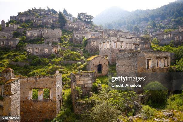 An aerial view of Greek houses and its surroundings are seen on the route of Lycian Way in Fethiye district of Mugla, Turkey on April 19, 2018....