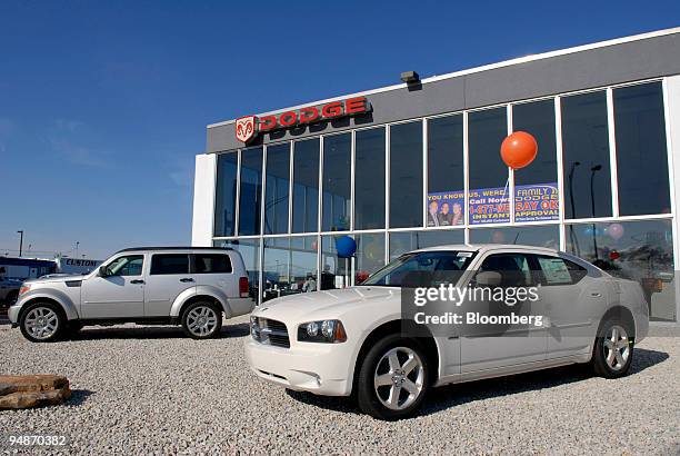 Dodge Nitro and Dodge Charger are displayed on a dealership lot in Philadelphia, Pennsylvania, U.S., on Saturday, March 29, 2008. Automobile sales in...