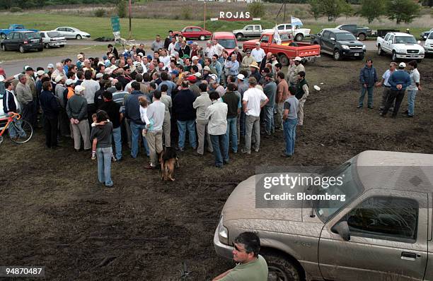 Farmers hold a meeting to decide on whether or not to lift road blockades in Rojas, 160 miles from Buenos Aires, Argentina, on Friday, March 28,...