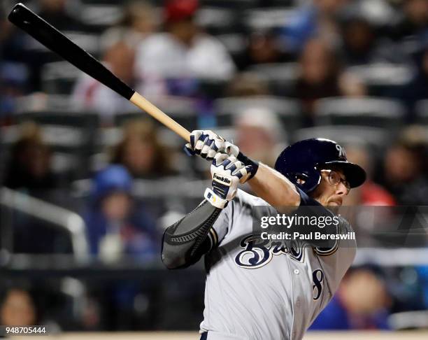 Eric Sogard of the Milwaukee Brewers follows through on his fly ball to right field in an MLB baseball game against the New York Mets on April 14,...