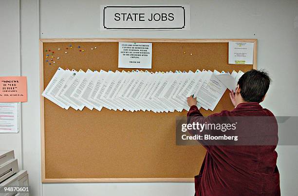 Nancy McWilliams looks through postings for State Jobs inside a branch of the City and County of Denver Office of Economic Development Thursday,...