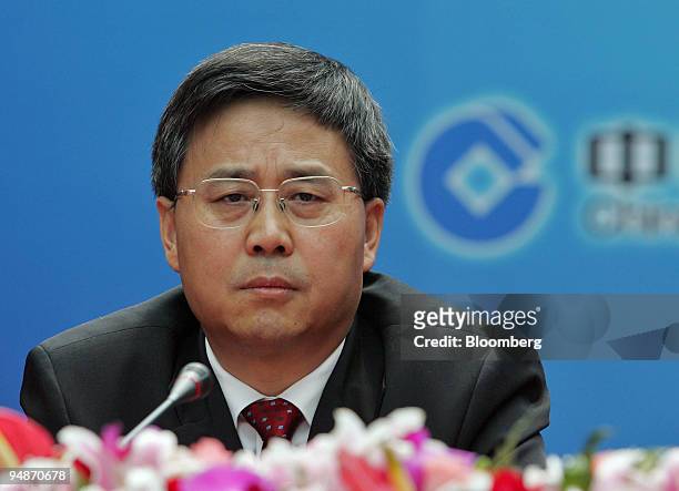 China Construction Bank Chairman Guo Shuqing listens at a press conference in Beijing, China Friday, June 17, 2005. Bank of America Corp., the...