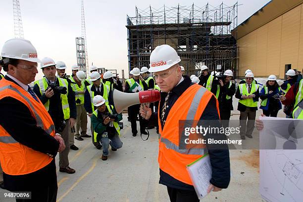 Laurence "Larry" Siegel, president of Meadowlands Development, center, pauses before speaking to members of the media during a tour of the Xanadu...