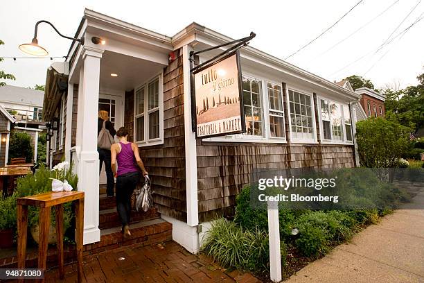 Patrons enter Tutto il Giorno, a restaurant located at 6 Bay Street in Sag Harbor, New York, U.S., on Sunday, July 27, 2008. When the restaurant's...