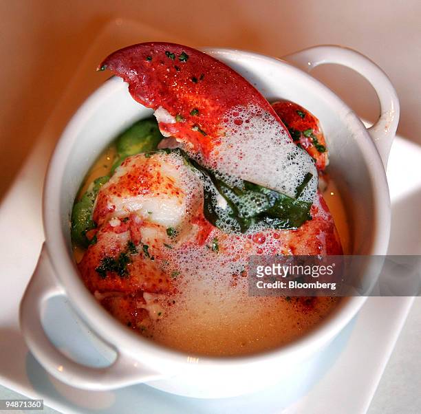 Langosta Y Vainilla' dish with butter poached lobster and roasted garlic flan with vanilla and basil is arranged for a photo at Mercat a la Planxa...
