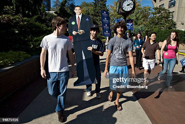 Hofstra University sophmore's, from left, Daniel Switz, Andrew Zeitlan, and Corey Kaminsky, carry a cut-out of Barack Obama outside the Student...