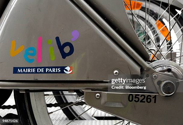 Velib' rental bicycles, supplied through a program run by JCDecaux, sit on a rack in Paris, France, on July 2008. JCDecaux releases its first-half...