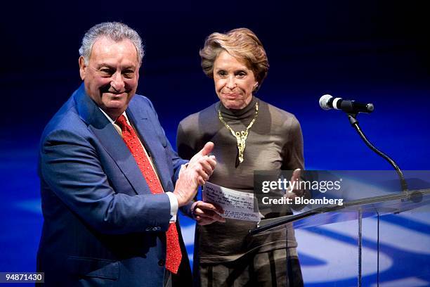 Joan H. Weill, chairman of the board of Alvin Ailey American Dance Theater, right, applauds with her husband Sanford "Sandy" Weill, former chairman...