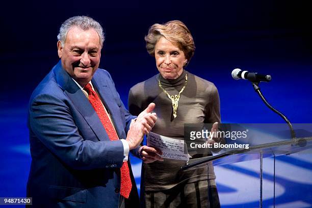 Joan H. Weill, chairman of the board of Alvin Ailey American Dance Theater, right, applauds with her husband Sanford "Sandy" Weill, former chairman...