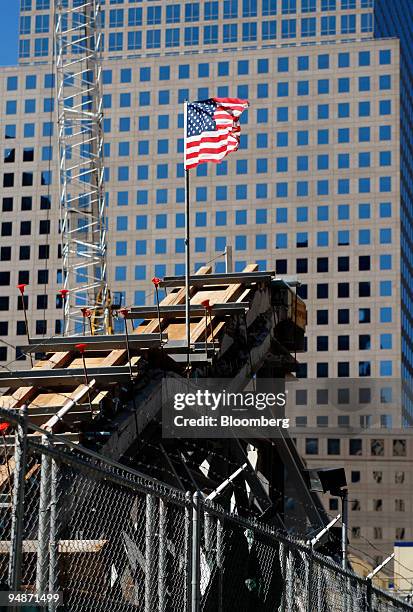 The U.S. Flag flies above the remnants of the Vesey Street Staircase at the World Trade Center site after it was moved in New York, U.S., on Sunday,...