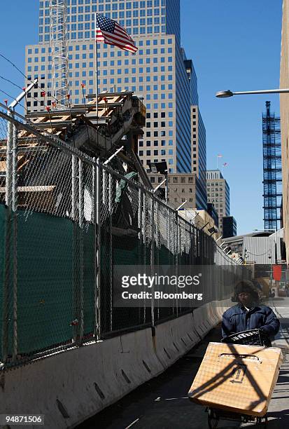 Man walks past the remnants of the Vesey Street Staircase at the World Trade Center site after it was moved in New York, U.S., on Sunday, March 9,...
