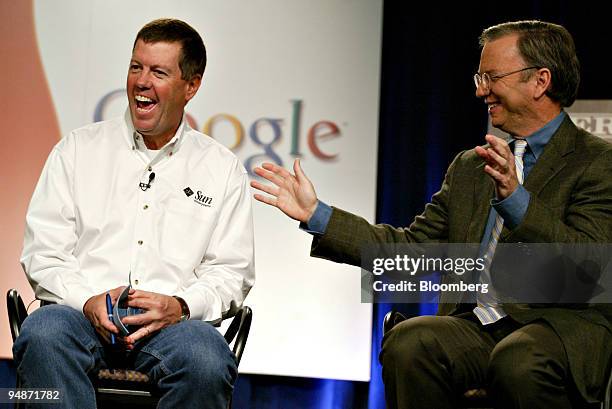 Scott McNealy, CEO of Sun Microsystems, left, and Dr. Eric Schmidt, CEO of Google Inc., share a laugh during a news conference at the Computer...