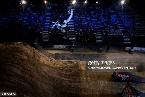 Australian rider Pat Bowden performs during a motocross freestyle show in Tours, on April 7, 2018. - Each time, their life is at stake : freestyle...