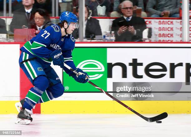 Ben Hutton of the Vancouver Canucks skates up ice with the puck during their NHL game against the Arizona Coyotes at Rogers Arena April 5, 2018 in...