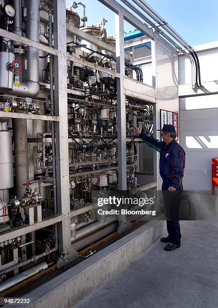 An operator checks Cosmo Oil Co. Ltd.'s Reformer and PSA unit at the Japan Hydrogen and Fuel Cell Development Project's Daikoku Hydrogen Station in...